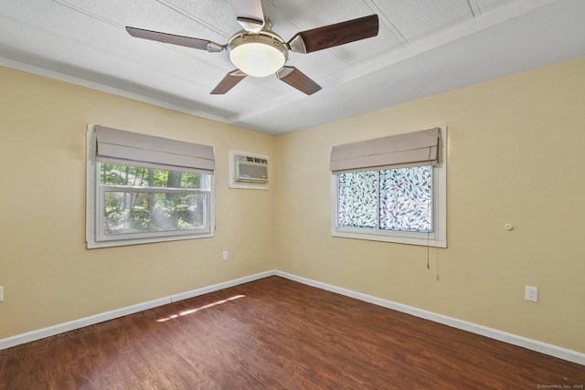 28 Nashua St, Norwich, CT 06360 - spare room with wood finished floors, a wall mounted air conditioner, and a ceiling fan