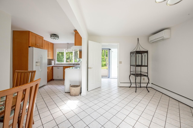 25 Old Middle Rd, Brookfield, CT 06804 - kitchen with white appliances, a wall mounted air conditioner, washer / clothes dryer, light countertops, and light tile patterned floors