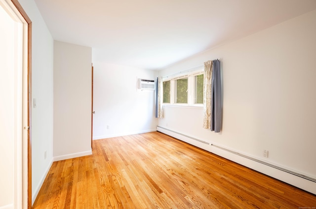25 Old Middle Rd, Brookfield, CT 06804 - empty room with baseboard heating, an AC wall unit, and light wood-style flooring