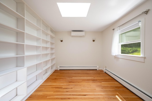 25 Old Middle Rd, Brookfield, CT 06804 - empty room with a baseboard radiator, a wall mounted air conditioner, light wood-type flooring, and a skylight