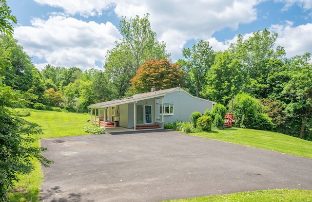 25 Old Middle Rd, Brookfield, CT 06804 - view of front of home featuring asphalt driveway, a front yard, and stucco siding