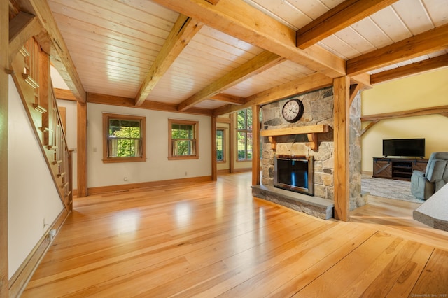18 Sandpiper Ln, East Lyme, CT 06333 - unfurnished living room with wood finished floors, a wooden ceiling with exposed beams, a fireplace, and stairway