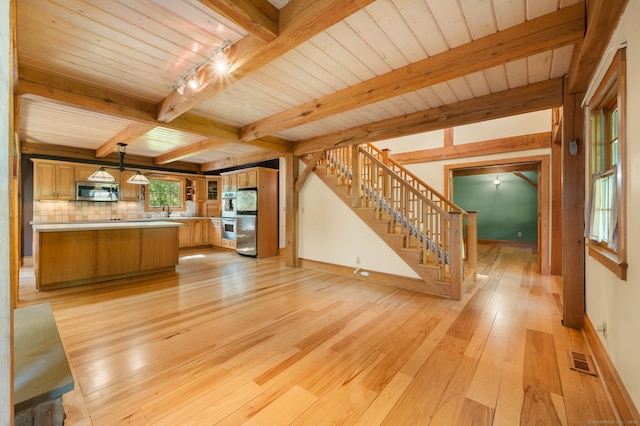 18 Sandpiper Ln, East Lyme, CT 06333 - unfurnished living room with stairs, light wood finished floors, and a wooden ceiling with exposed beams