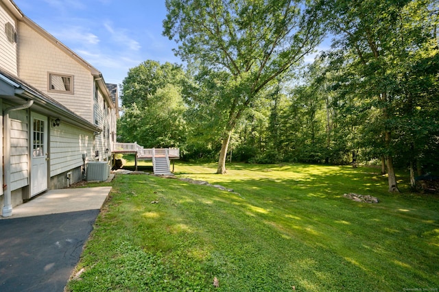 18 Sandpiper Ln, East Lyme, CT 06333 - view of grassy yard featuring a wooden deck and stairs