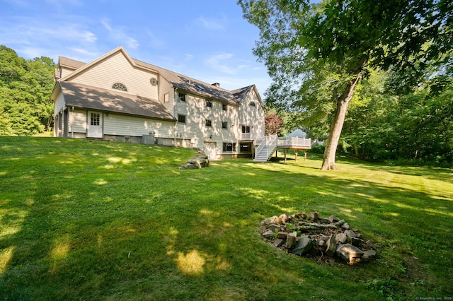 18 Sandpiper Ln, East Lyme, CT 06333 - rear view of property featuring stairs, a deck, and a yard