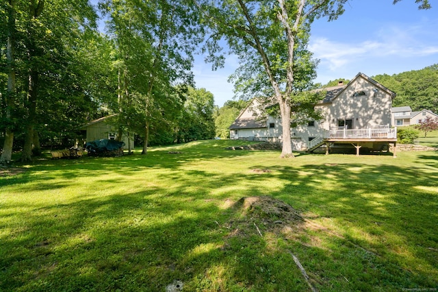 18 Sandpiper Ln, East Lyme, CT 06333 - view of green lawn with a deck