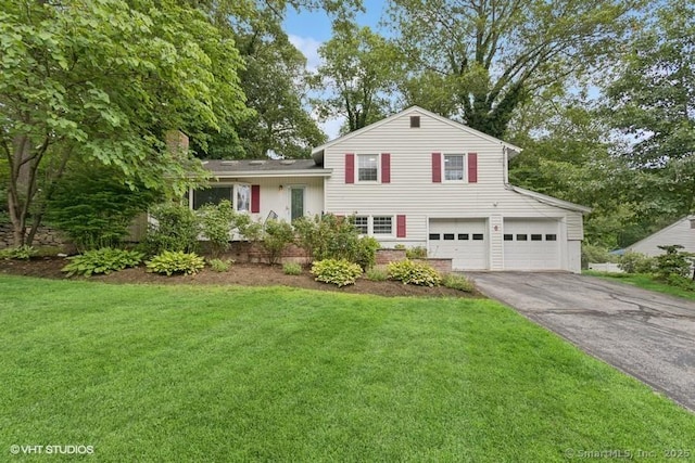 6 Kingsbury Rd, Norwalk, CT 06851 - split level home with asphalt driveway, an attached garage, and a front yard