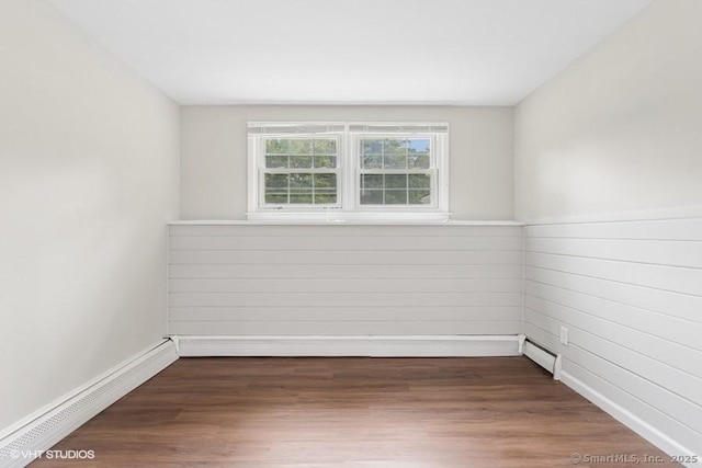6 Kingsbury Rd, Norwalk, CT 06851 - spare room with a baseboard heating unit and wood finished floors