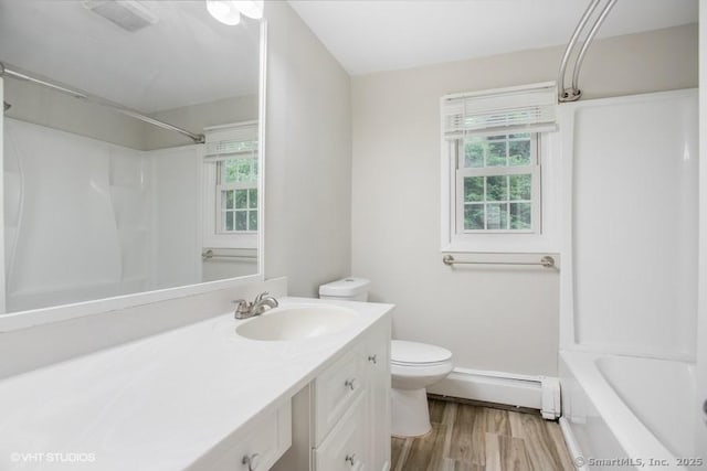 6 Kingsbury Rd, Norwalk, CT 06851 - bathroom featuring a baseboard heating unit, vanity, wood finished floors, and bathtub / shower combination