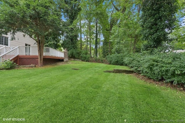 6 Kingsbury Rd, Norwalk, CT 06851 - view of grassy yard with a wooden deck