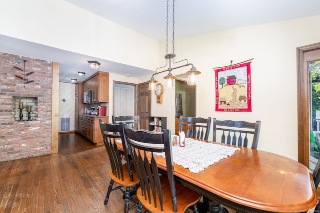 26 Skyview Ter, Bristol, CT 06010 - dining room with dark wood-style floors and a fireplace