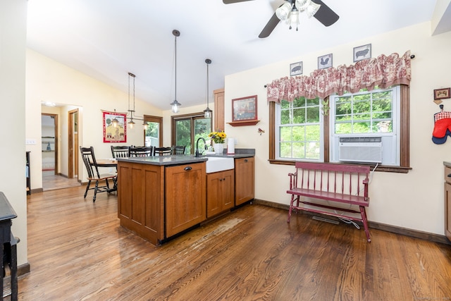 26 Skyview Ter, Bristol, CT 06010 - kitchen featuring brown cabinets, a peninsula, dark wood-style floors, cooling unit, and vaulted ceiling