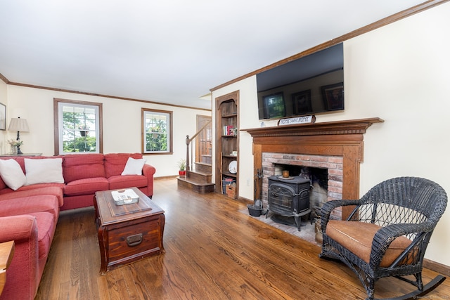 26 Skyview Ter, Bristol, CT 06010 - living area with ornamental molding, wood finished floors, stairs, a wood stove, and built in shelves