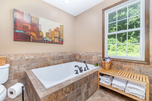 26 Skyview Ter, Bristol, CT 06010 - full bath featuring plenty of natural light, a garden tub, tile walls, and a wainscoted wall