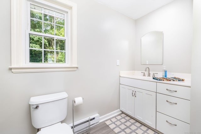 26 Skyview Ter, Bristol, CT 06010 - bathroom featuring a baseboard radiator, vanity, and wood finished floors