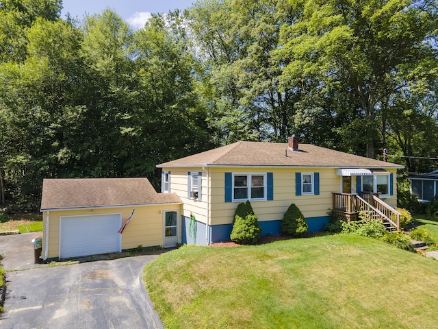 15 Denis Dr, Thompson, CT 06255 - view of front facade with driveway, a garage, a front lawn, and a chimney