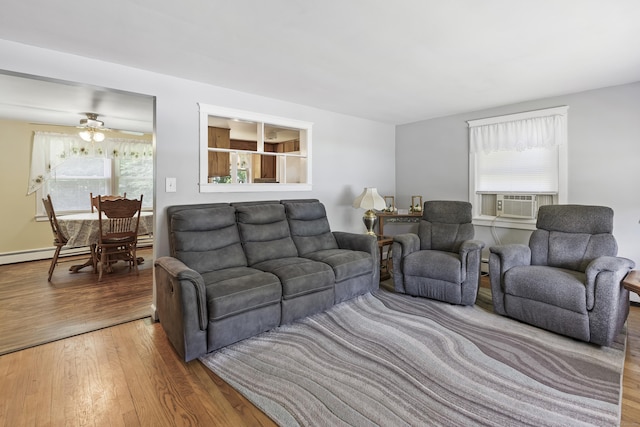 15 Denis Dr, Thompson, CT 06255 - living area with wood finished floors, plenty of natural light, and cooling unit