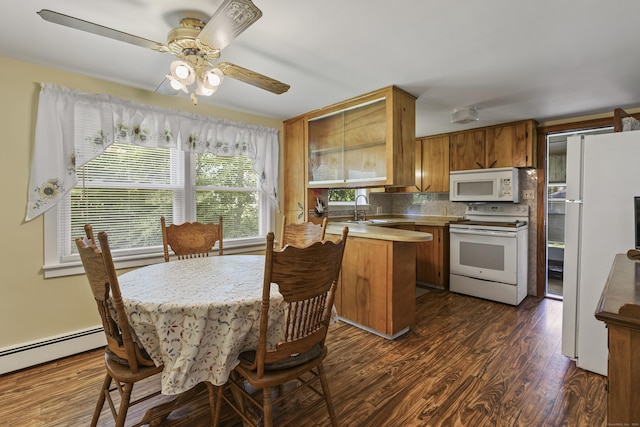 15 Denis Dr, Thompson, CT 06255 - kitchen featuring white appliances, brown cabinetry, a peninsula, dark wood-style floors, and light countertops