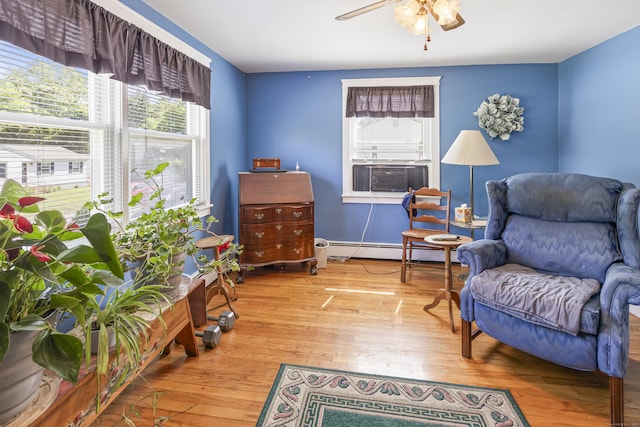 15 Denis Dr, Thompson, CT 06255 - sitting room with baseboard heating, cooling unit, plenty of natural light, and a ceiling fan