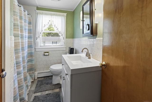 15 Denis Dr, Thompson, CT 06255 - full bath with tile walls, a baseboard radiator, vanity, wood finished floors, and ornamental molding