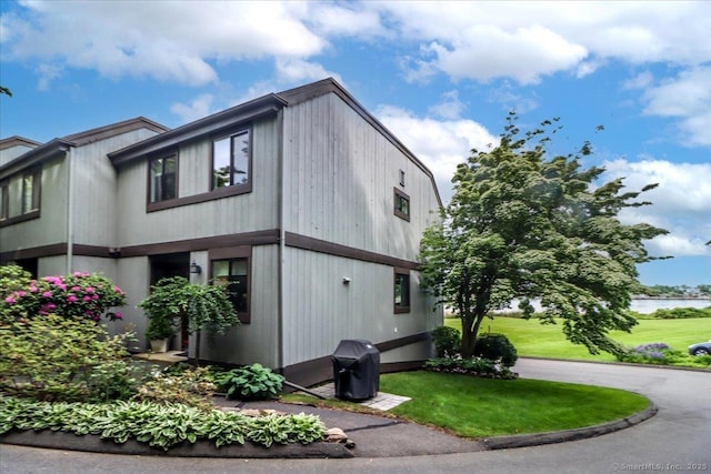 17 Harbour Vlg Unit F, Branford, CT 06405 - view of property exterior with a lawn and a water view
