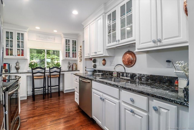 17 Harbour Vlg Unit F, Branford, CT 06405 - kitchen with stainless steel appliances, white cabinets, dark wood finished floors, glass insert cabinets, and dark stone countertops