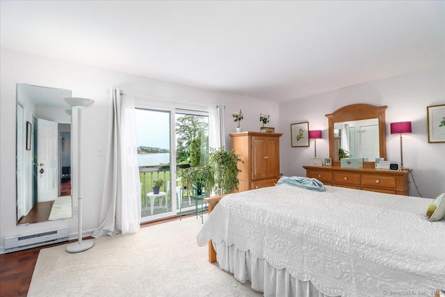 17 Harbour Vlg Unit F, Branford, CT 06405 - bedroom featuring a baseboard radiator, access to exterior, and wood finished floors
