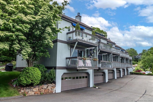 17 Harbour Vlg Unit F, Branford, CT 06405 - view of property with asphalt driveway and an attached garage