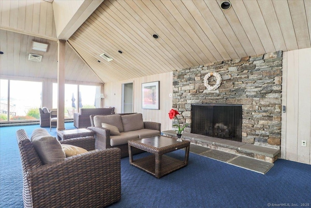 17 Harbour Vlg Unit F, Branford, CT 06405 - living room featuring carpet floors, a stone fireplace, wood ceiling, a baseboard radiator, and vaulted ceiling
