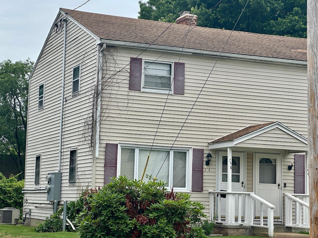238 Larkin Ct, Stratford, CT 06615 - view of property featuring a chimney