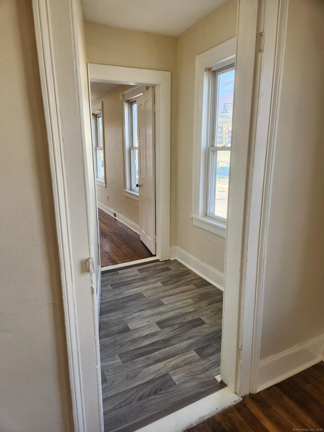 293 Central Ave, Norwich, CT 06360 - corridor featuring dark wood finished floors and baseboards