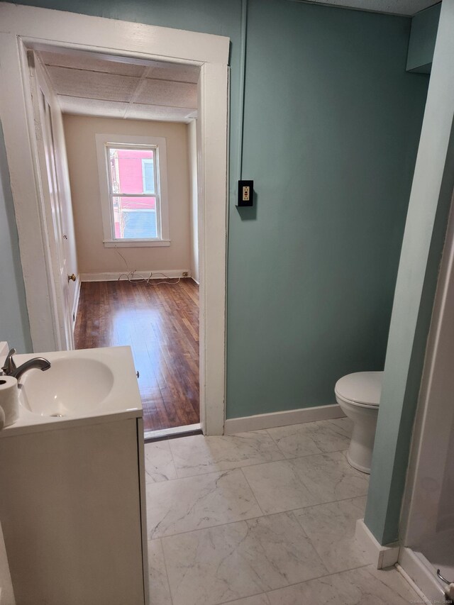 293 Central Ave, Norwich, CT 06360 - bathroom featuring vanity and marble finish flooring