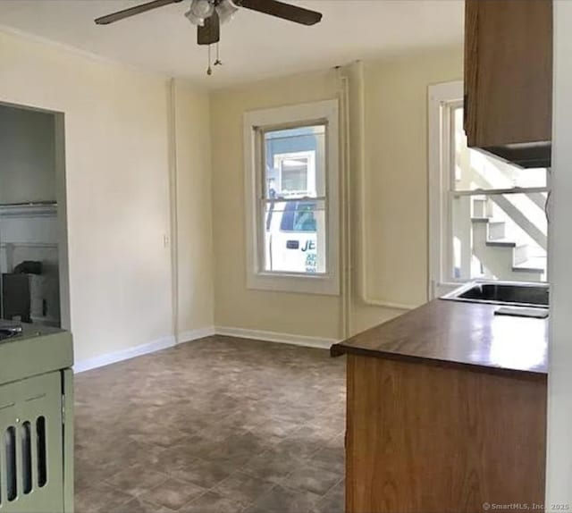 293 Central Ave, Norwich, CT 06360 - kitchen featuring a ceiling fan and baseboards