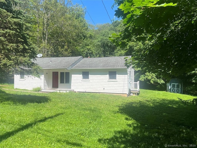 70 Watermelon Hill Rd, Carmel, NY 10541 - rear view of house featuring a shed, a lawn, and a shingled roof