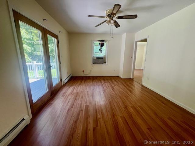 70 Watermelon Hill Rd, Carmel, NY 10541 - spare room with a baseboard radiator, wood finished floors, cooling unit, and a ceiling fan