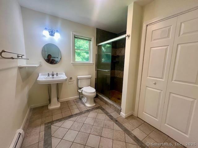 70 Watermelon Hill Rd, Carmel, NY 10541 - full bath with a baseboard heating unit, tile patterned floors, a stall shower, and inlaid floor details