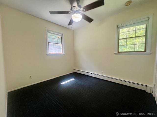 70 Watermelon Hill Rd, Carmel, NY 10541 - empty room with a baseboard radiator, dark wood-style floors, ceiling fan, and a smoke detector