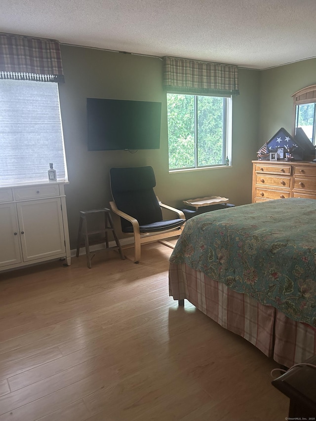 7 Harbour Vlg Unit A, Branford, CT 06405 - bedroom with a textured ceiling and light wood finished floors