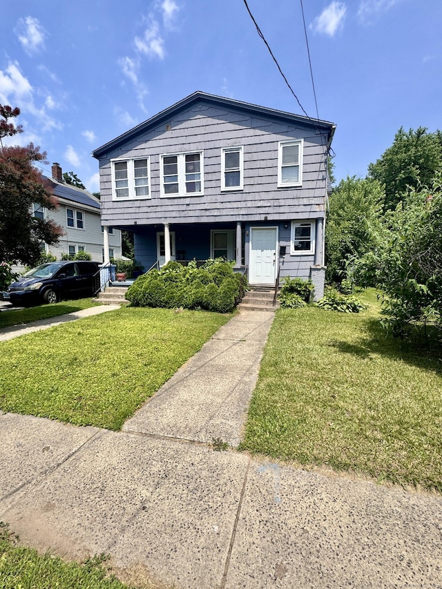 33 Wilson Ave, Windsor, CT 06095 - view of front of property with covered porch and a front yard