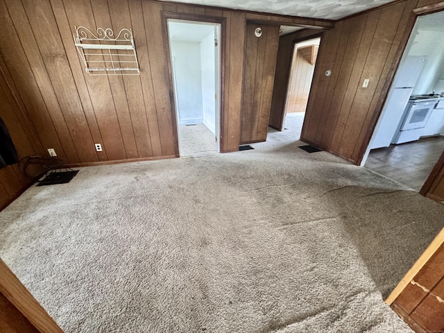 33 Wilson Ave, Windsor, CT 06095 - carpeted empty room featuring wood walls