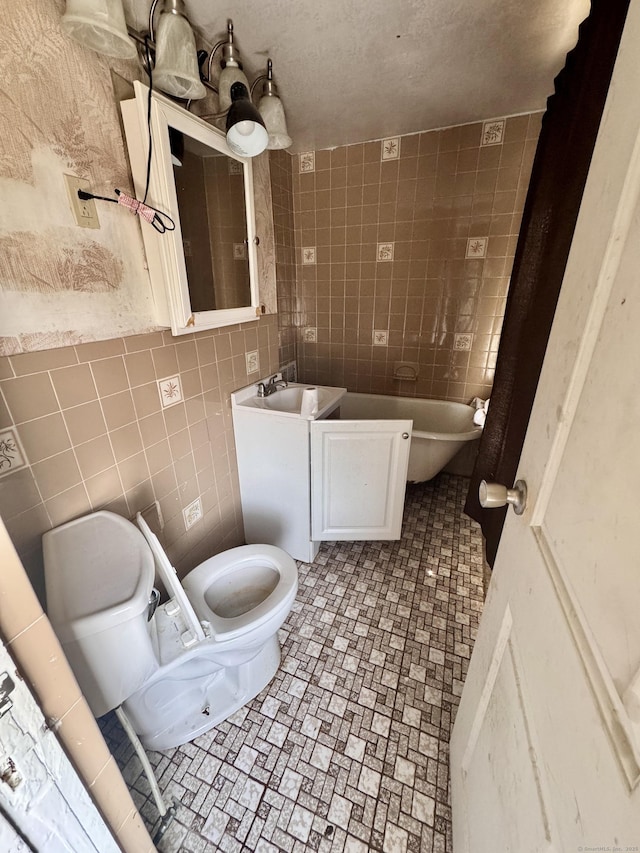 33 Wilson Ave, Windsor, CT 06095 - bathroom featuring toilet and tile walls