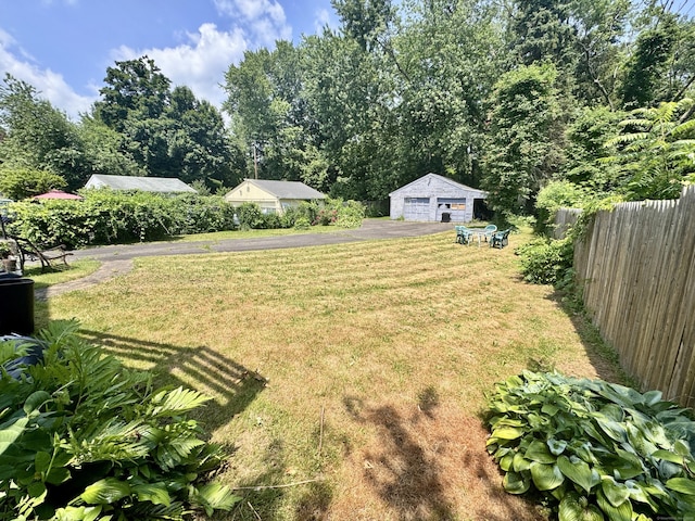33 Wilson Ave, Windsor, CT 06095 - view of yard featuring a garage and an outbuilding