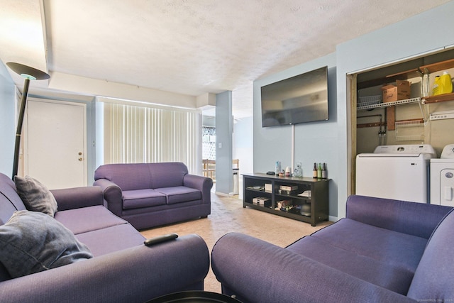 11 Cedar Ct Unit C, East Haven, CT 06513 - carpeted living room featuring separate washer and dryer and a textured ceiling