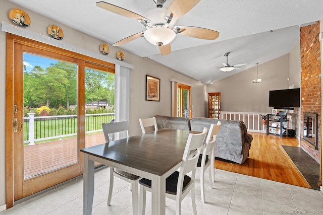475 Pine Tree Dr, Orange, CT 06477 - dining area featuring ceiling fan, light tile patterned flooring, and vaulted ceiling