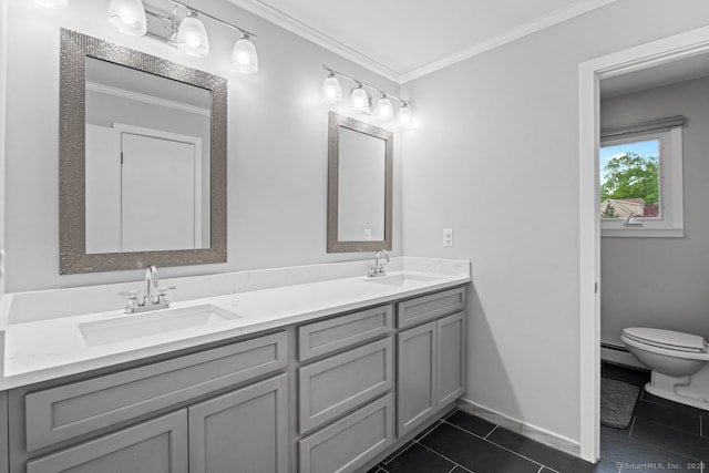 475 Pine Tree Dr, Orange, CT 06477 - bathroom with double vanity, ornamental molding, tile patterned flooring, and a baseboard radiator