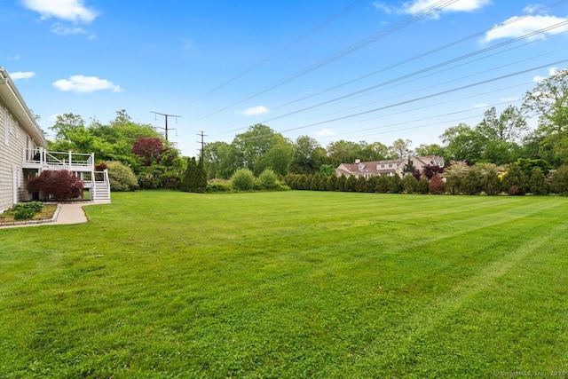 475 Pine Tree Dr, Orange, CT 06477 - view of green lawn featuring stairway and view of scattered trees