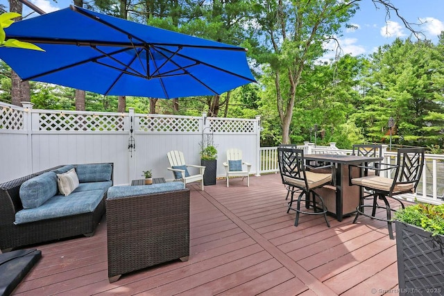 18 Chestnut Hill Rd, Simsbury, CT 06092 - wooden terrace with outdoor dining space, an outdoor hangout area, and view of wooded area