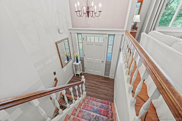 18 Chestnut Hill Rd, Simsbury, CT 06092 - foyer featuring wood finished floors, a chandelier, and stairs