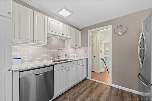 18 Chestnut Hill Rd, Simsbury, CT 06092 - kitchen featuring stainless steel appliances, white cabinets, dark wood-style floors, and decorative backsplash
