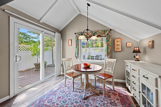 18 Chestnut Hill Rd, Simsbury, CT 06092 - dining space featuring wood finished floors, vaulted ceiling, and a chandelier